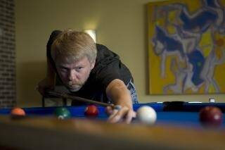 George McBane playing pool